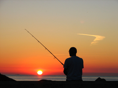Sonnenuntergangs-Angler